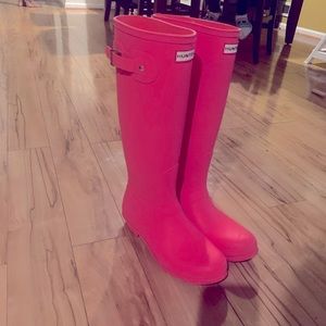 Hot pink rain boots.